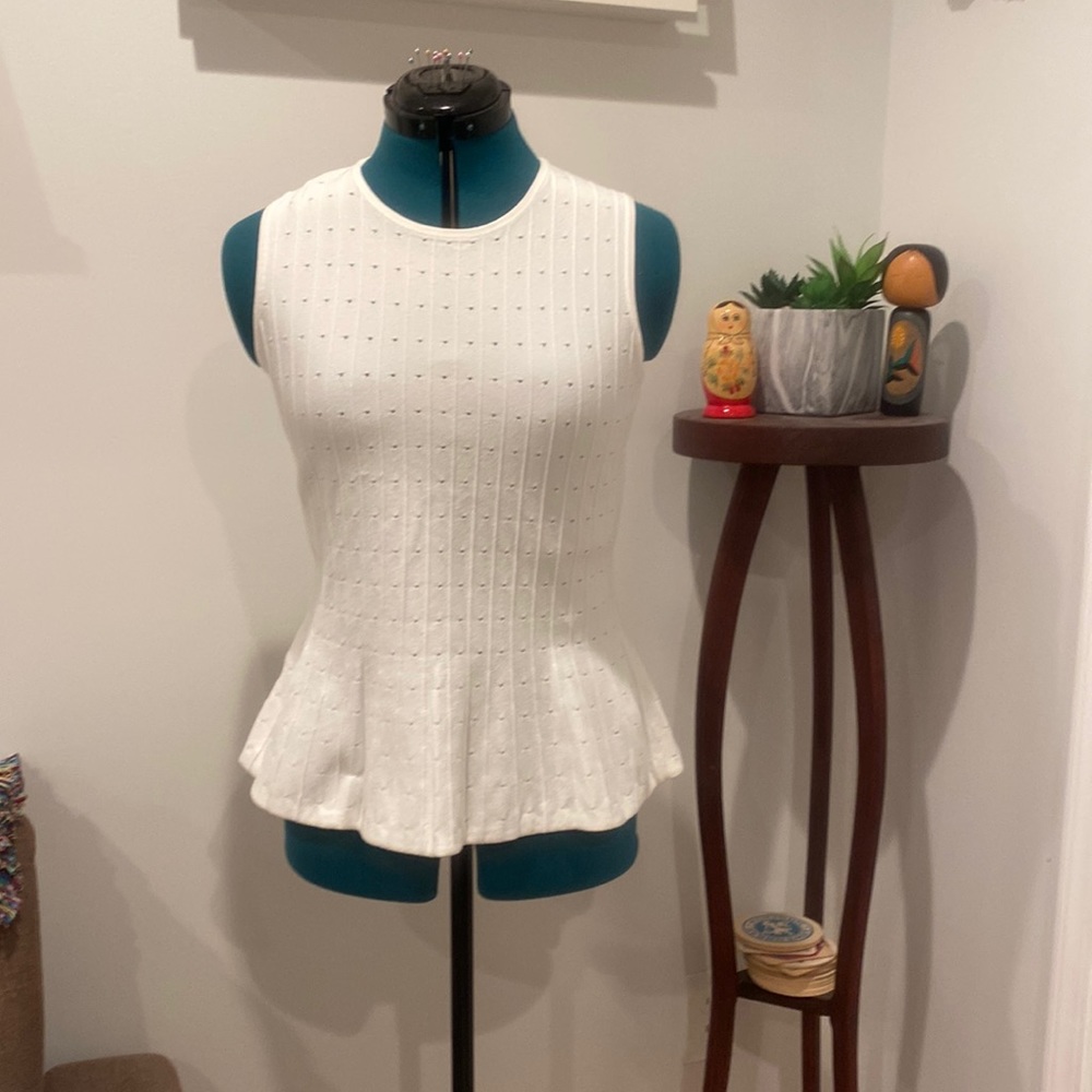 Sleeveless peplum sweater